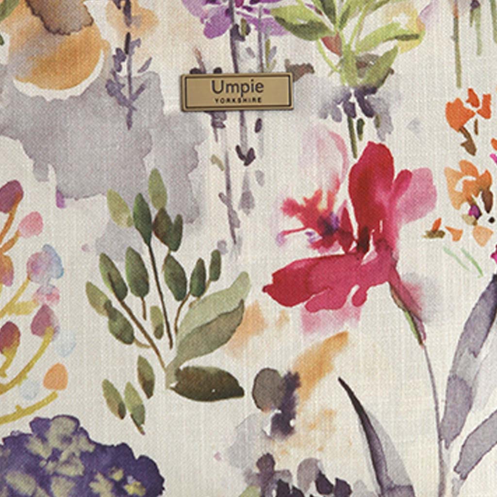 Close-up of delicate botanical floral print on premium linen fabric in soft pink tones, handmade in Great Britain by Umpie Handbags