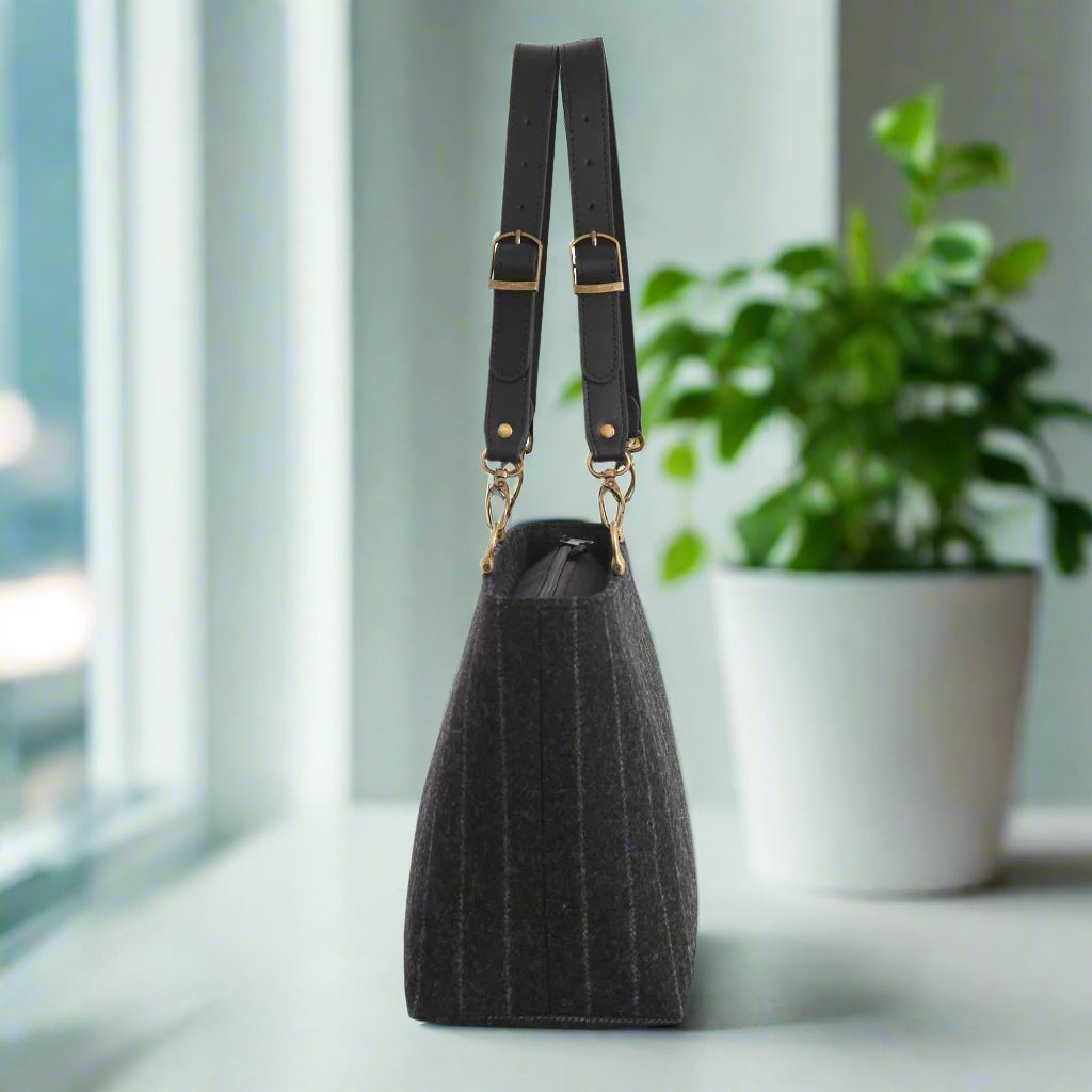 The Pinstripe shoulder bag with black leather straps - side view