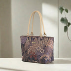 Purple Brocade Shoulder Bag showing shimmering metallic floral pattern and beige leather straps by Umpie Handbag 
