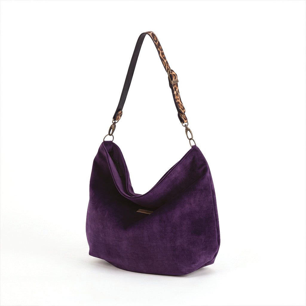 A purple velvet hobo hobo bag with a leopard print leather strap, shown on a plain white background, by Umpie Handbags