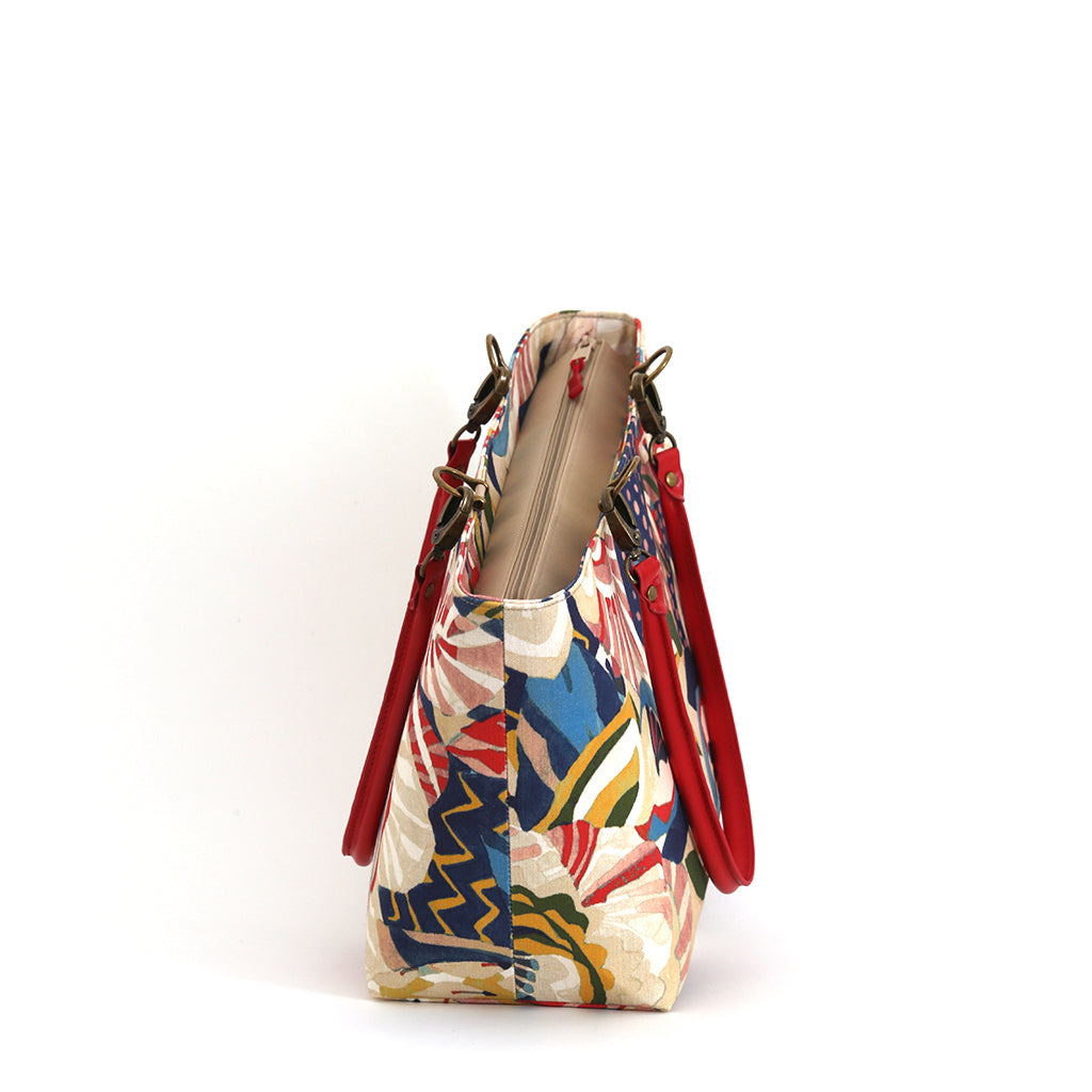 The zip-top  view of the red floral shoulder bag with red leather handles, handmade in Yorkshire by Umpie Handbags.