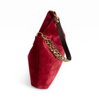 Top-zip detail of the red velvet hobo bag showing antique gold zip closure and leopard print leather strap by Umpie Handbags