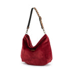 Front view of the rich crimson red velvet hobo bag with leopard print leather strap and antique gold hardware by Umpie Handbags