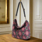 Luxurious Tabriz velvet hobo bag with rich textured fabric and sleek black leather strap, showcasing elegant slouchy silhouette by Umpie Handbags