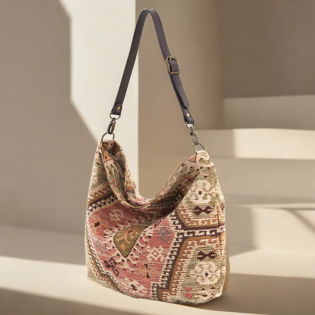 The Tapestry Hobo Bag with a brown leather strap