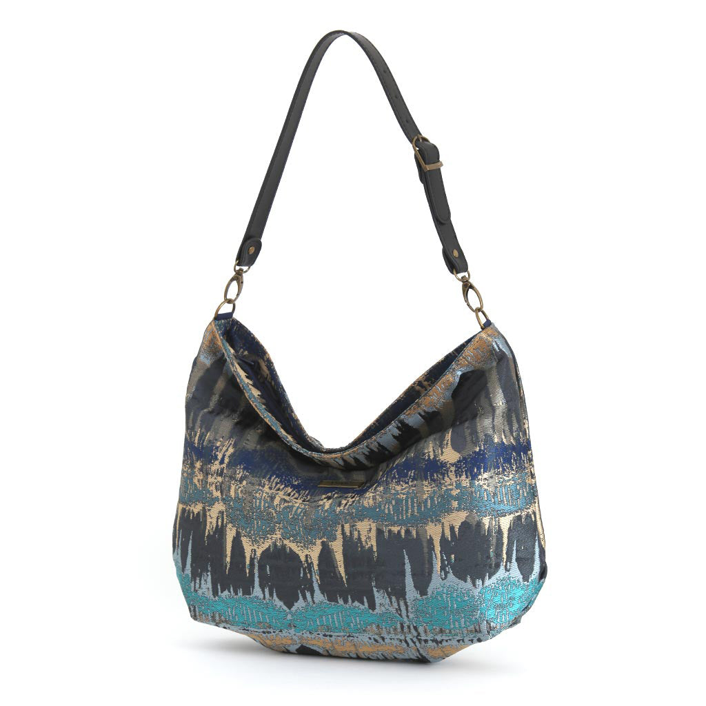 Teal Metallic Hobo Bag displaying relaxed hobo silhouette and adjustable black leather strap by Umpie Handbags
