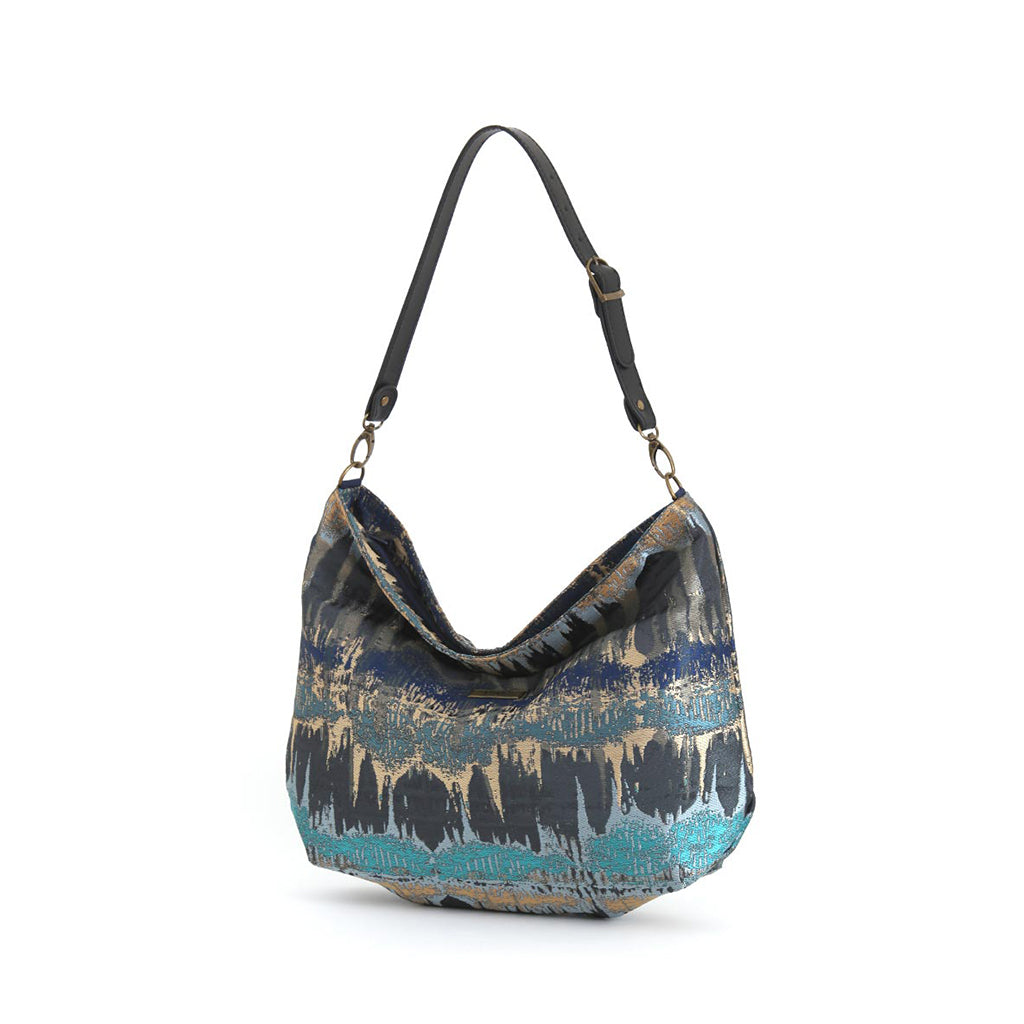 Teal Metallic Hobo Bag displaying relaxed hobo silhouette and adjustable black leather strap by Umpie Handbags
