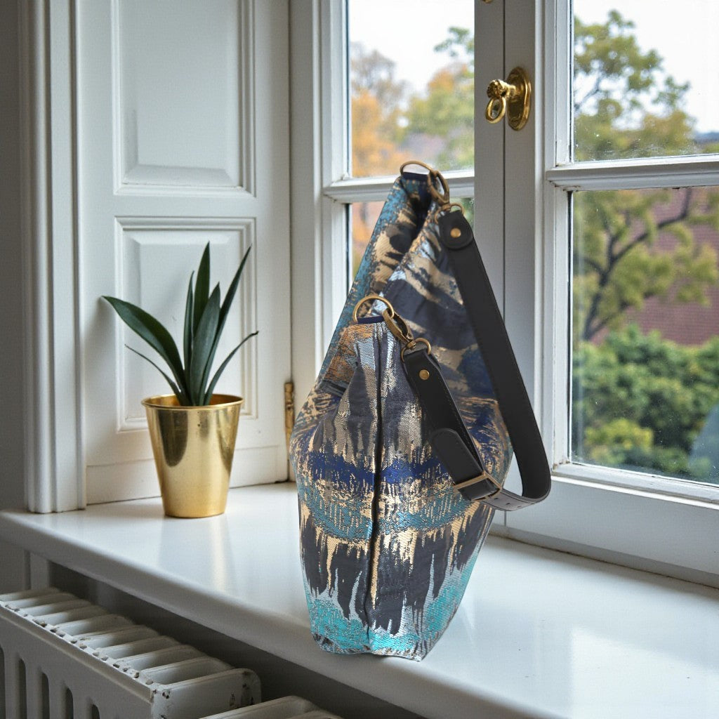 Top zip detail of Teal Metallic Hobo Bag revealing spacious interior and secure closure by Umpie Handbags