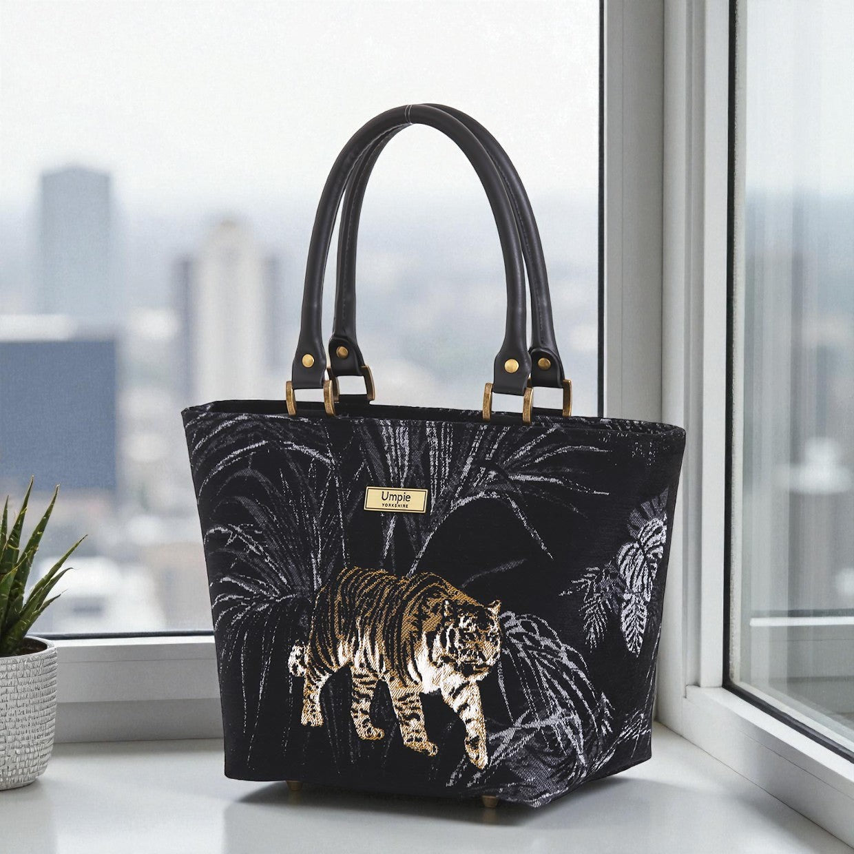 Tiger handbag in vibrant gold and black tapestry fabric with premium black leather handles, structured silhouette and artisan British craftsmanship by Umpie Handbags
