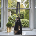 Side profile of Tiger Tote Bag displaying structured silhouette and premium leather straps by Umpie Handbags

