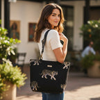 Tiger Tote Bag carried by model showing bold tiger print tapestry and black leather straps by Umpie Handbags