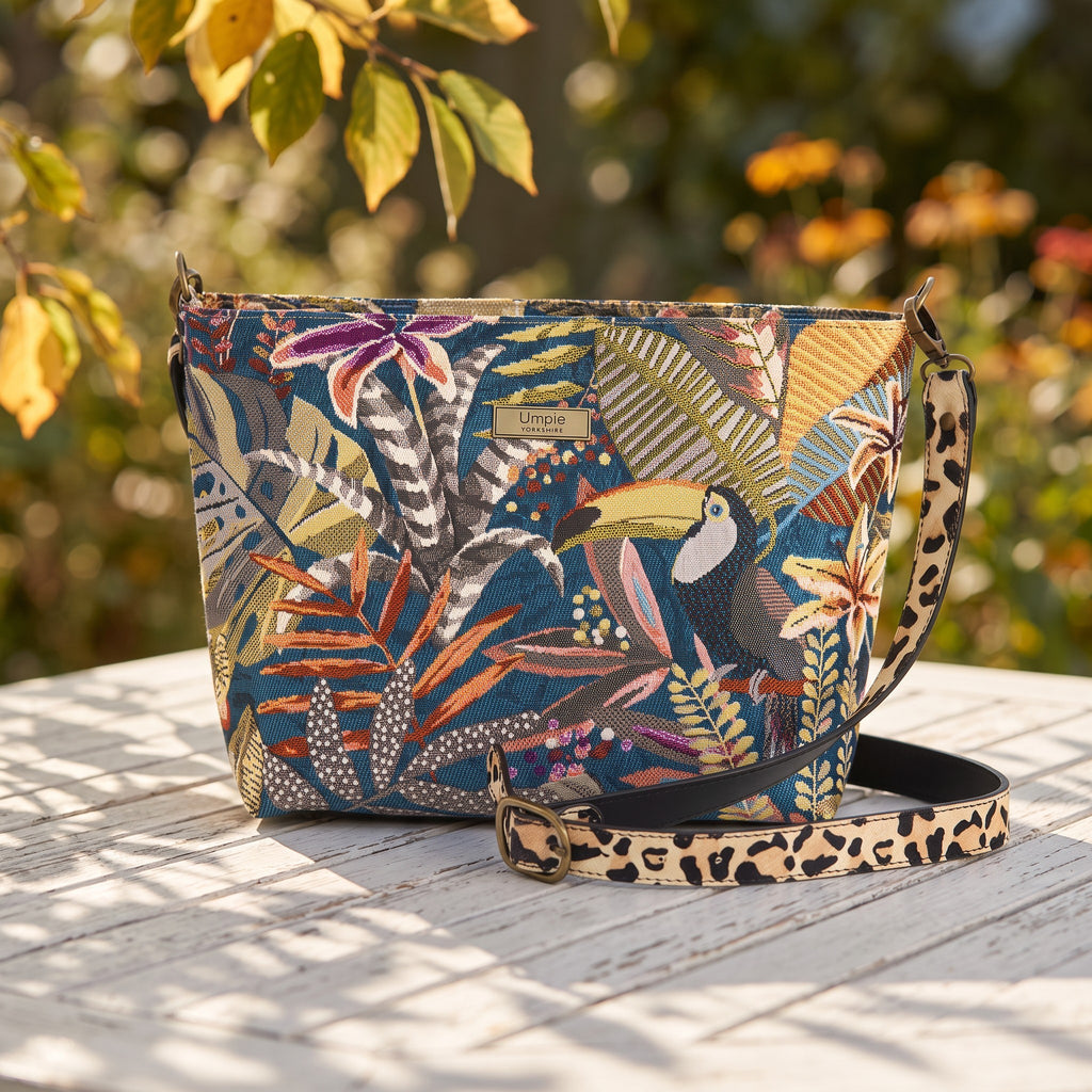 The Toucan Tapestry Crossbody Bag in a late summer early autumn setting  highlighting the beautifu lrich colours of this unique handbag, by Umpie Handbags