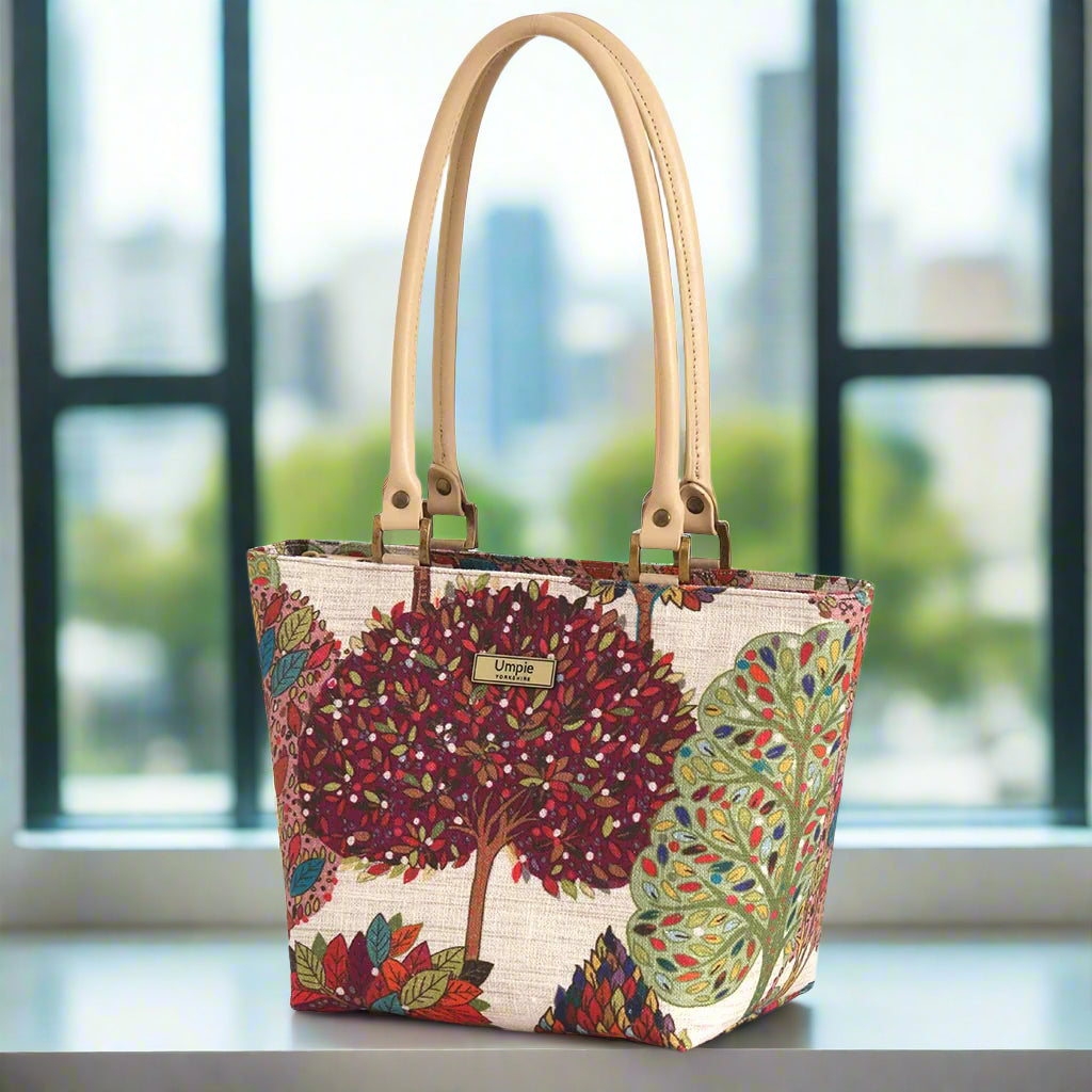 The Arboreal Small Shoulder Bag with tan leather handles