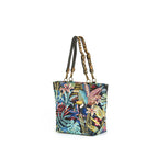 Angled front view of Tropical Toucan Shoulder Bag on white background, richly woven toucan and jungle foliage tapestry on navy with leopard print leather handles and antique gold hardware, by Umpie Handbags