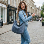 Velvet hobo bag in blue with bold leopard print leather strap, front view showing rich texture and slouchy silhouette by Umpie Handbags