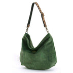 Luxurious Green velvet hobo bag with bold leopard print leather strap, front view showing rich texture and slouchy silhouette by Umpie Handbags