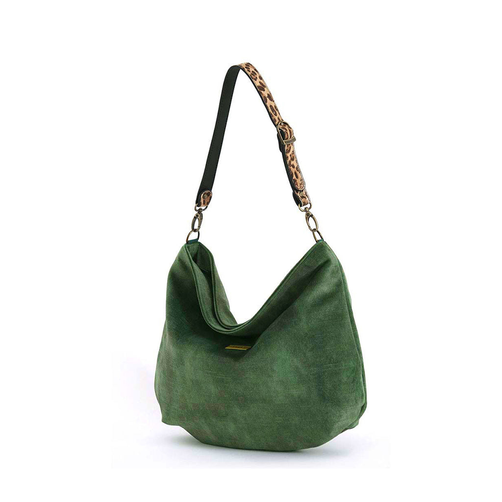 Luxurious green velvet hobo bag with bold leopard print leather strap, front view showing rich texture and slouchy silhouette by Umpie Handbags