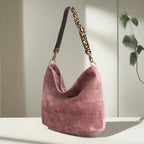 Luxurious Pink velvet hobo bag with bold leopard print leather strap, front view showing rich texture and slouchy silhouette by Umpie Handbags