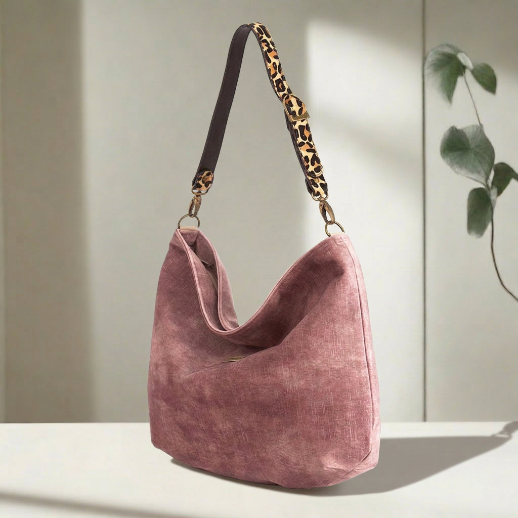 Luxurious Pink velvet hobo bag with bold leopard print leather strap, front view showing rich texture and slouchy silhouette by Umpie Handbags