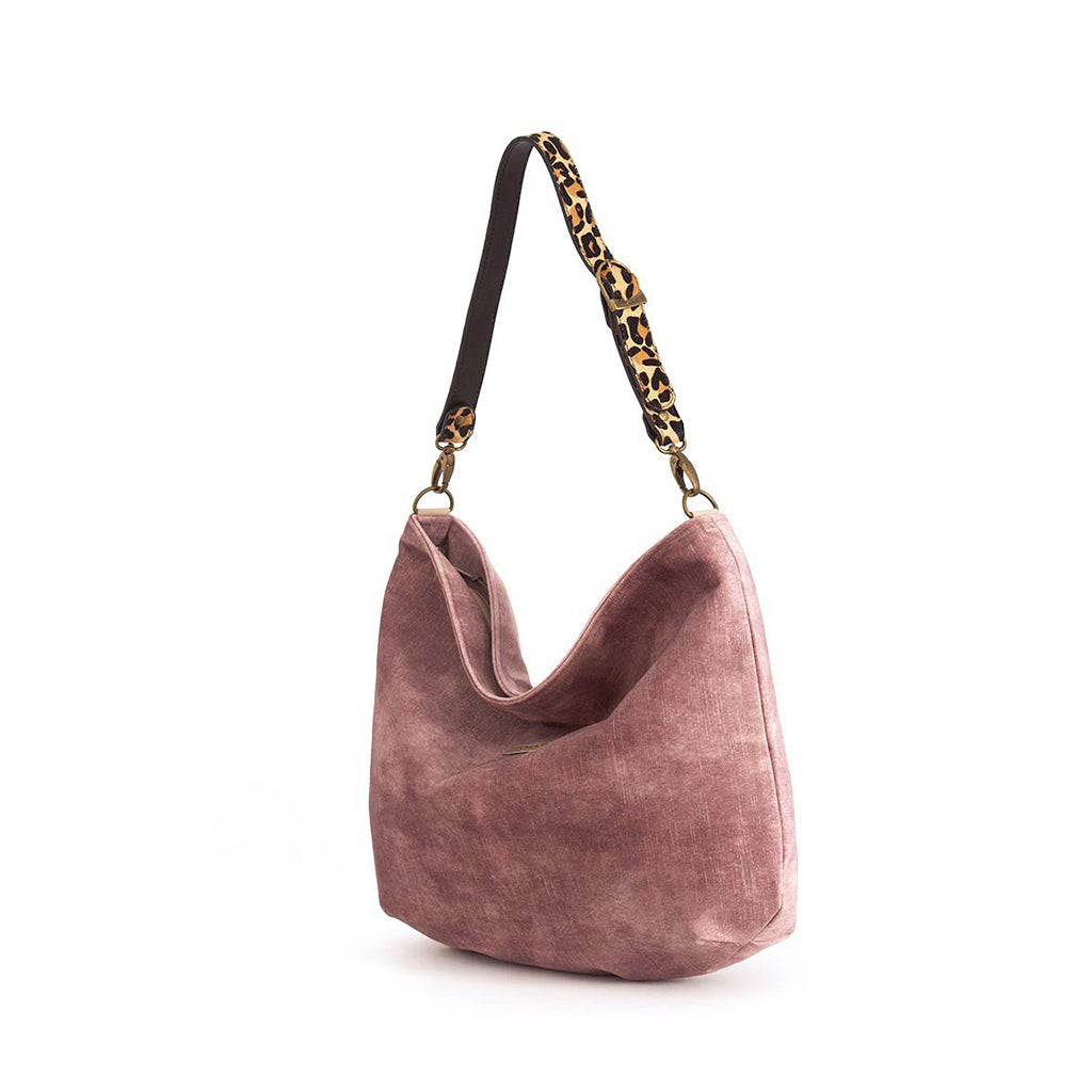 Luxurious pink velvet hobo bag with bold leopard print leather strap, front view showing rich texture and slouchy silhouette by Umpie Handbags