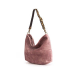 Luxurious pink velvet hobo bag with bold leopard print leather strap, front view showing rich texture and slouchy silhouette by Umpie Handbags