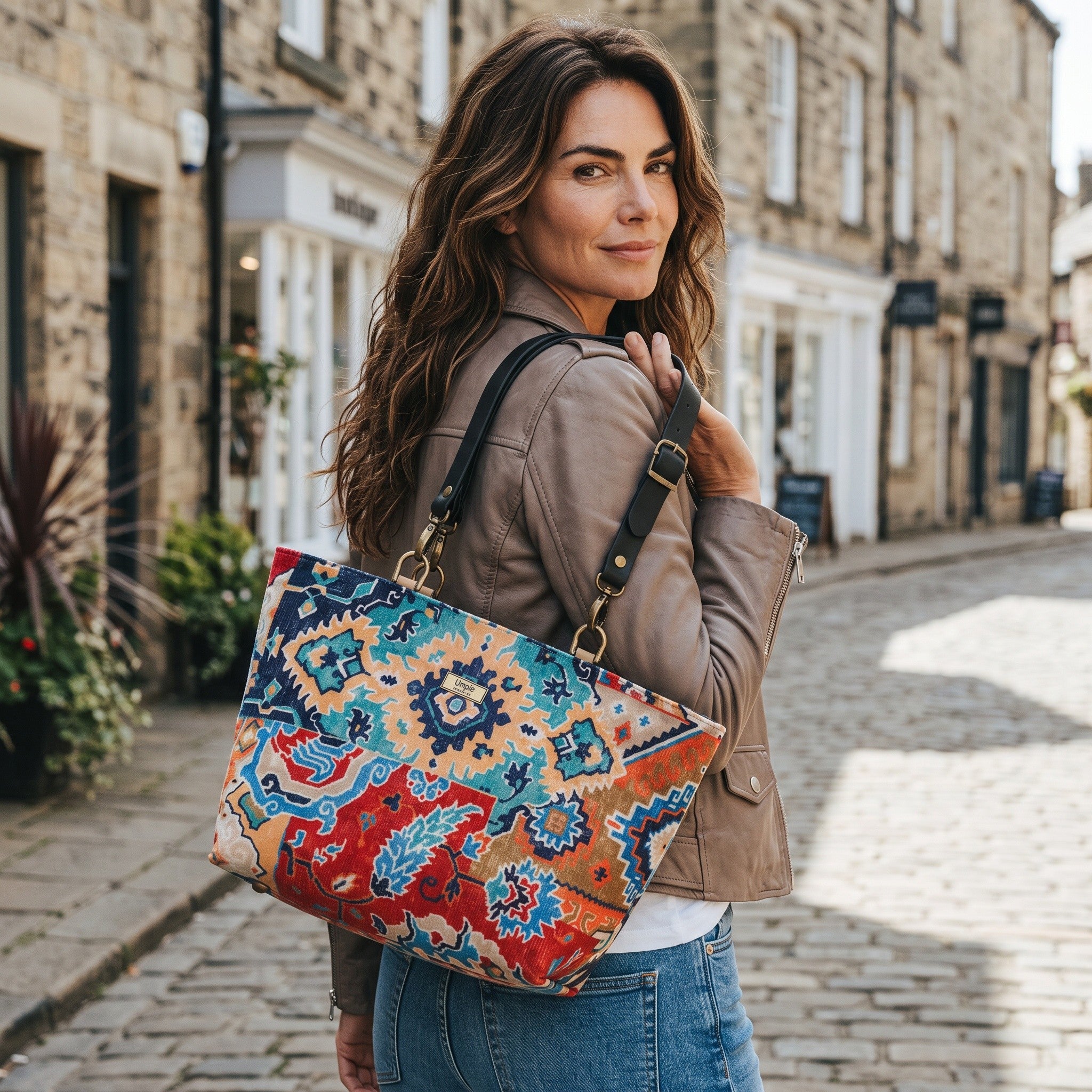 Kilim Velvet Shoulder Bag, carried by a model in Harrogate. Handmade in Yorkshire by Umpie Handbags