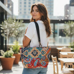 Model wearing luxurious velvet shoulder bag featuring intricate kilim geometric pattern in rich jewel tones with soft tactile texture, showcasing elegant styling and heritage textile craftsmanship by Umpie Handbags