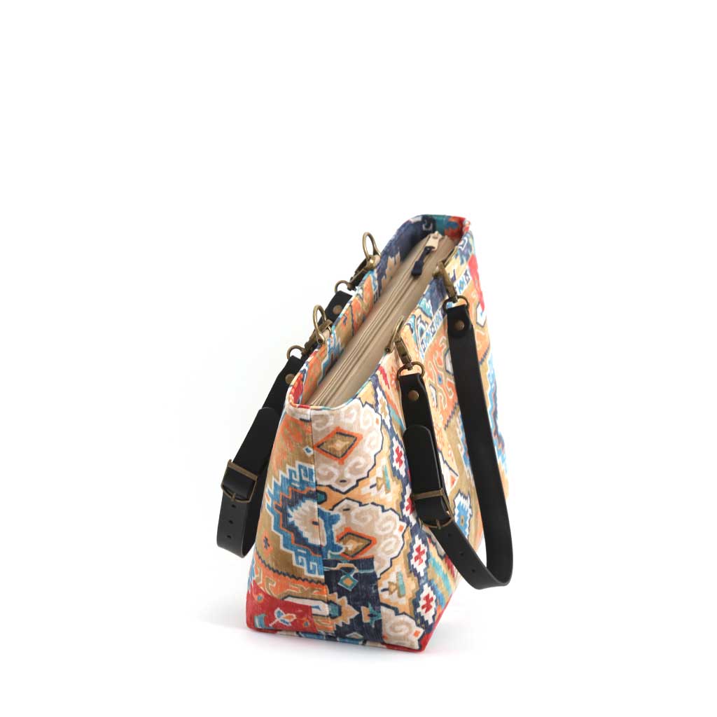 Kilim Velvet Shoulder Bag showcasing rich texture and traditional geometric design with black leather straps by Umpie Handbags - zip-top view