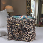 Handcrafted metallic leopard print weekend bag front view showing airline cabin-sized proportions and artisan construction by Umpie Handbags