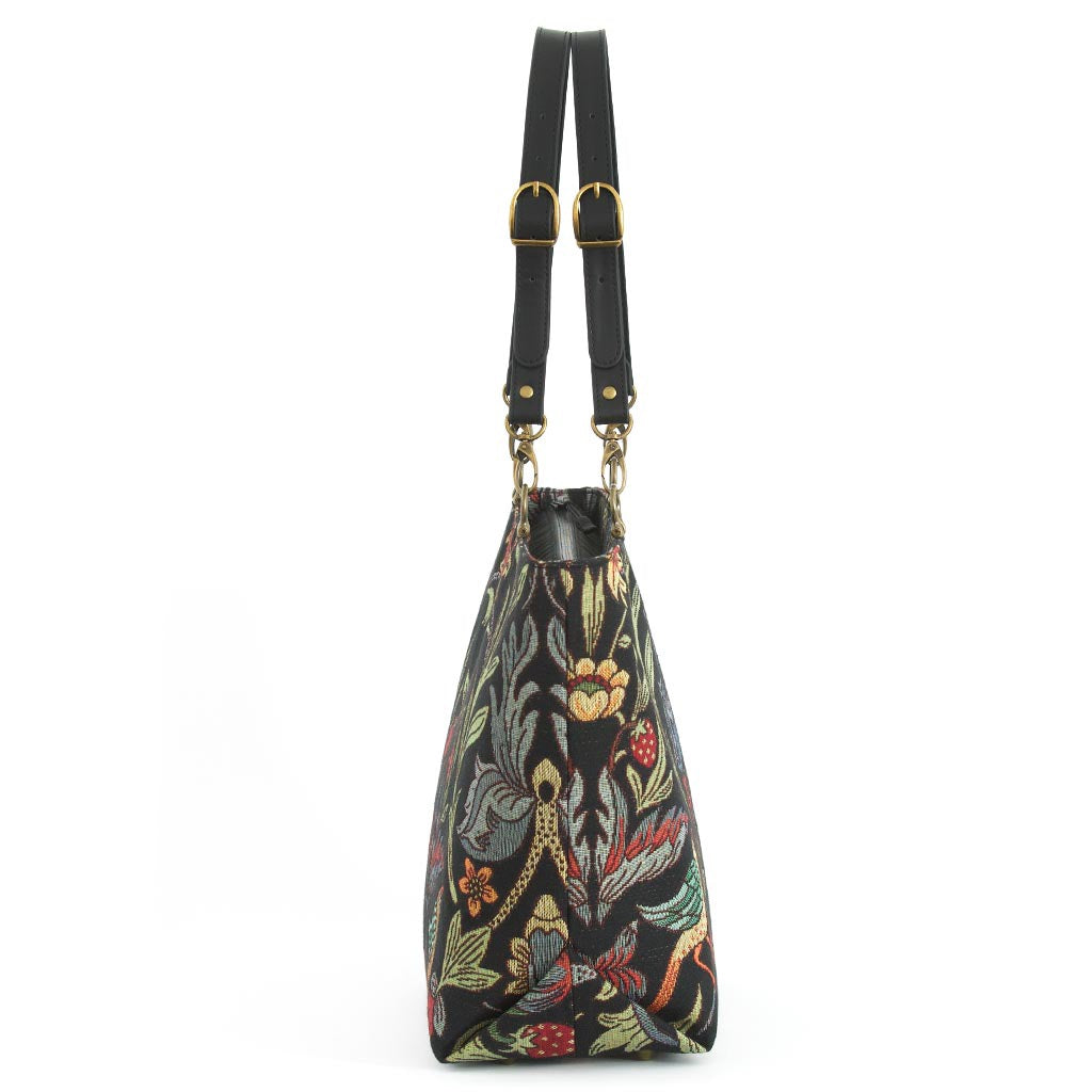 William Morris Shoulder Bag showing side view of Victorian botanical tapestry and black leather straps by Umpie Handbags