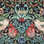 Luxurious hobo bag featuring William Morris's iconic Strawberry Thief pattern in rich indigo blue with delicate birds and strawberry motifs, crafted with premium fabric and leather trim, fabric close-up view showcasing the Strawberry Thief fabric by Umpie Handbags