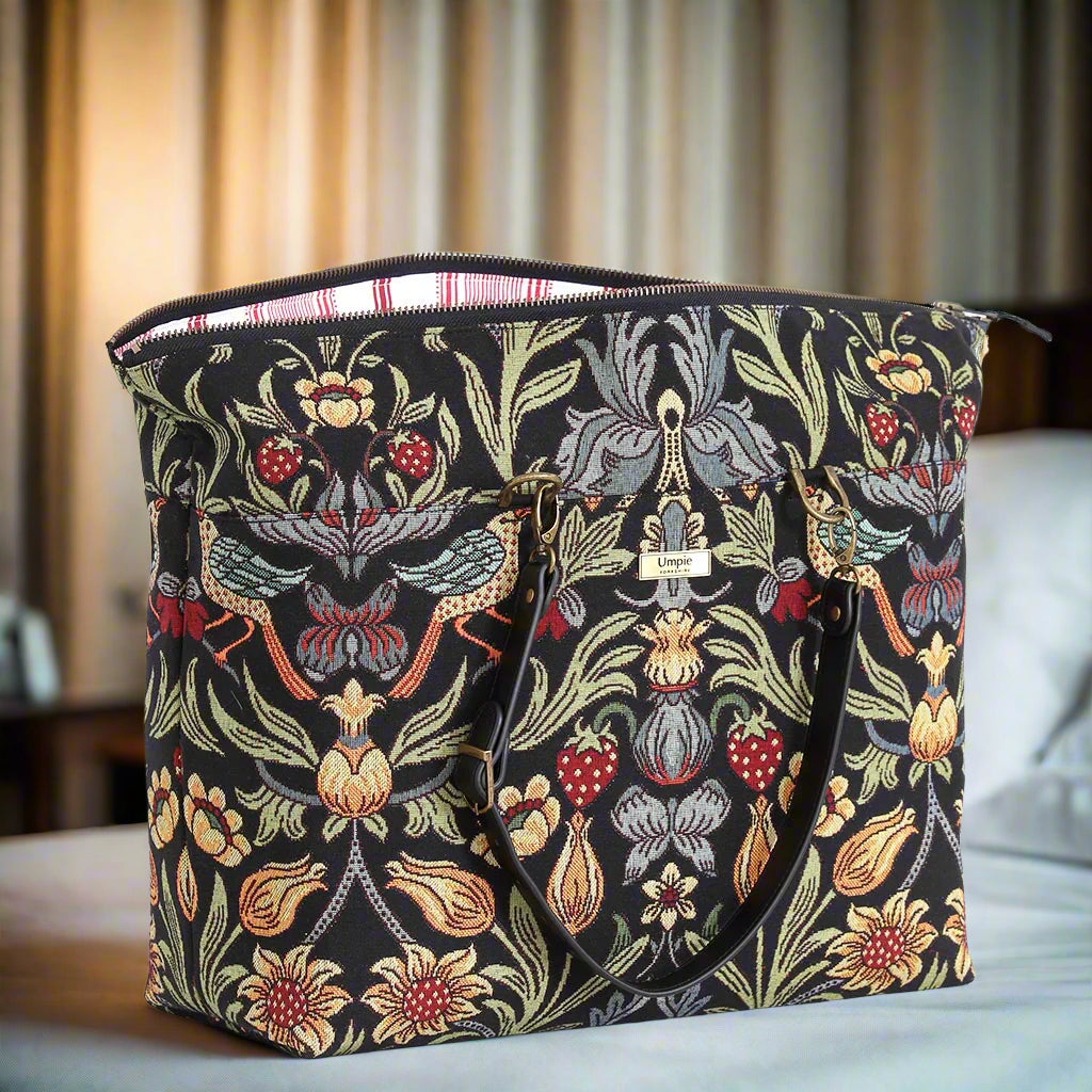 Close-up of William Morris travel bag displaying secure zip-top closure and detailed Morris pattern tapestry with quality stitching and robust black leather trim by Umpie Handbags