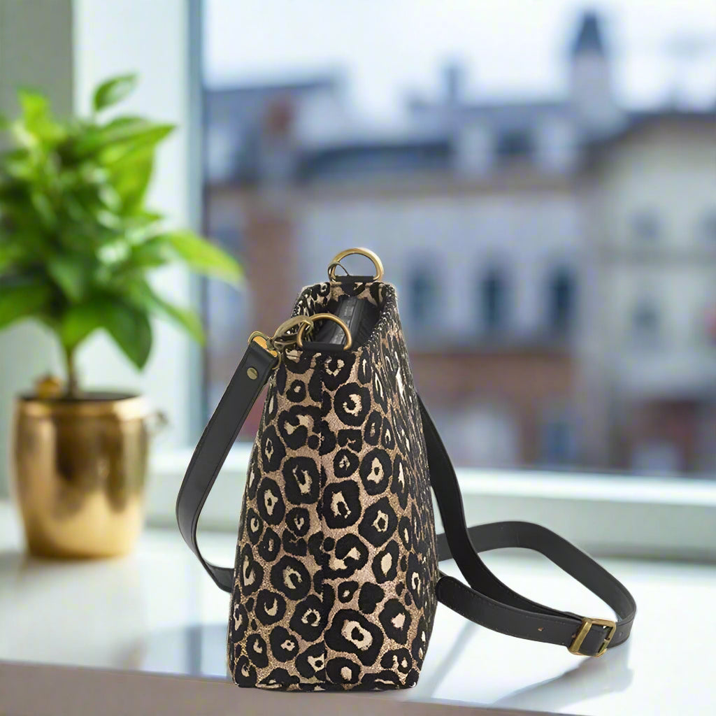 Leopard print crossbody bag with black leather strap by Umpie Handbags - side view