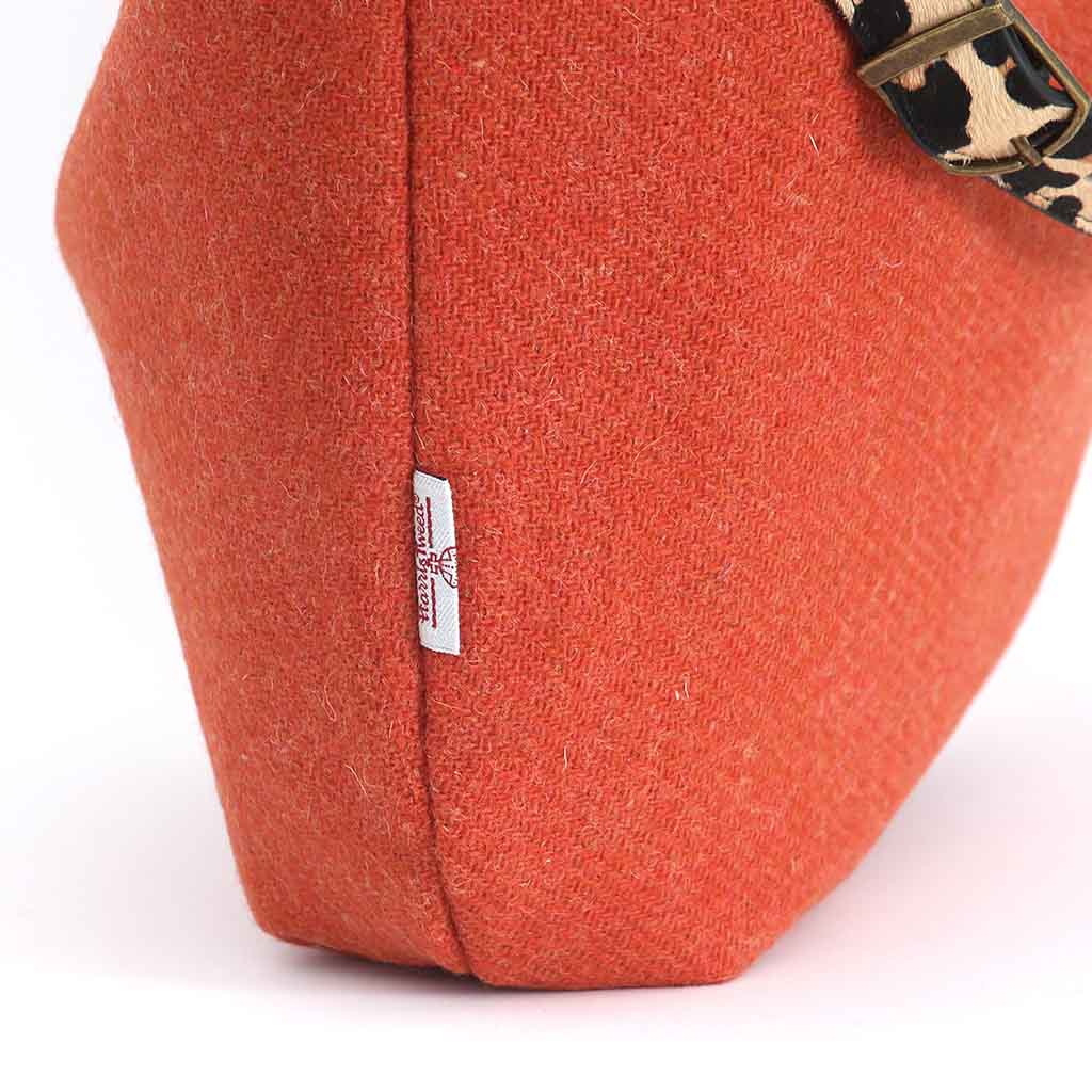 Orange Harris Tweed Hobo Bag with a leopard print leather strap by Umpie Handbags - fabric view