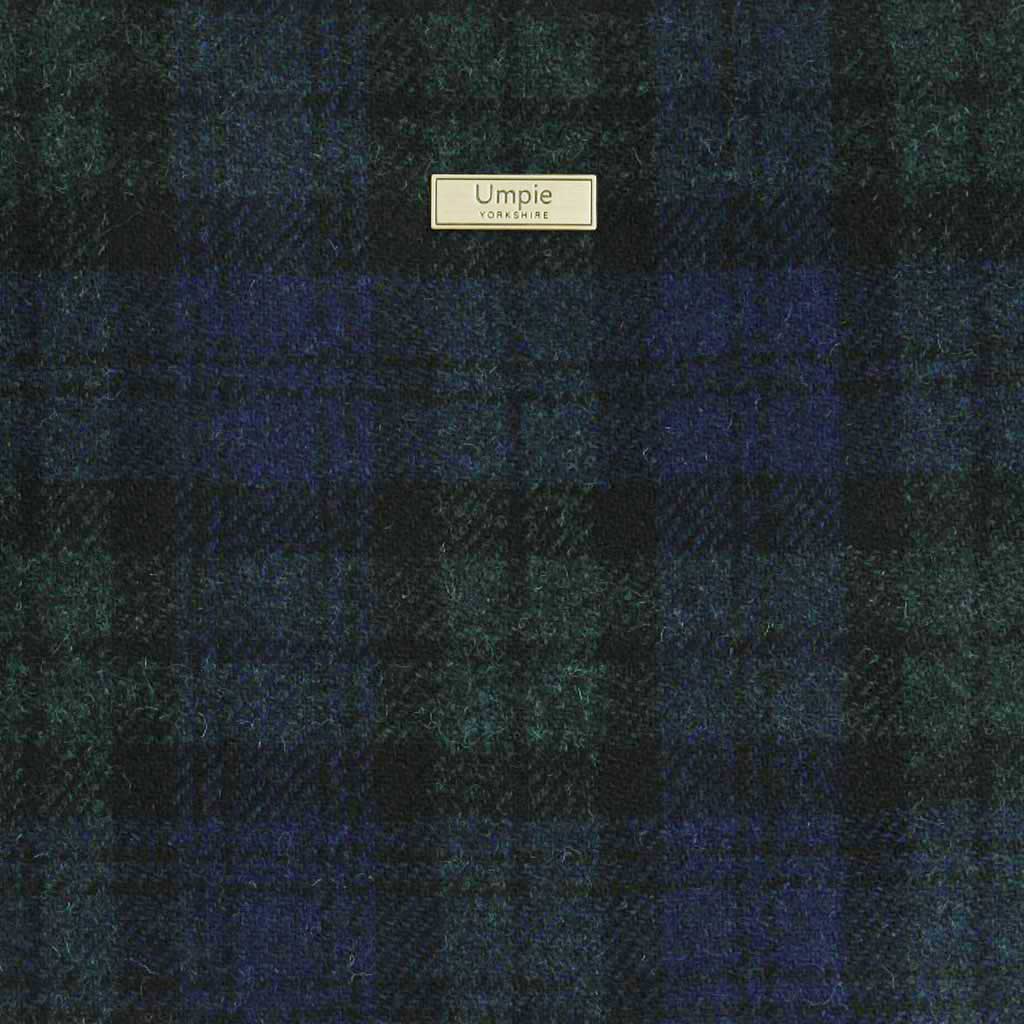 Exquisite Harris Tweed Black Watch Tartan weave close-up - authentic Scottish wool showcasing centuries of Hebridean textile mastery