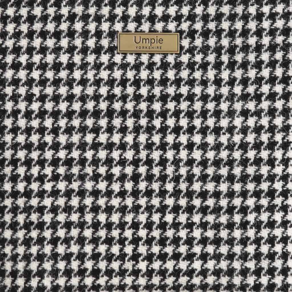 Harris Tweed houndstooth pattern close-up by Umpie Handbags - Authentic Scottish wool weave with traditional geometric design