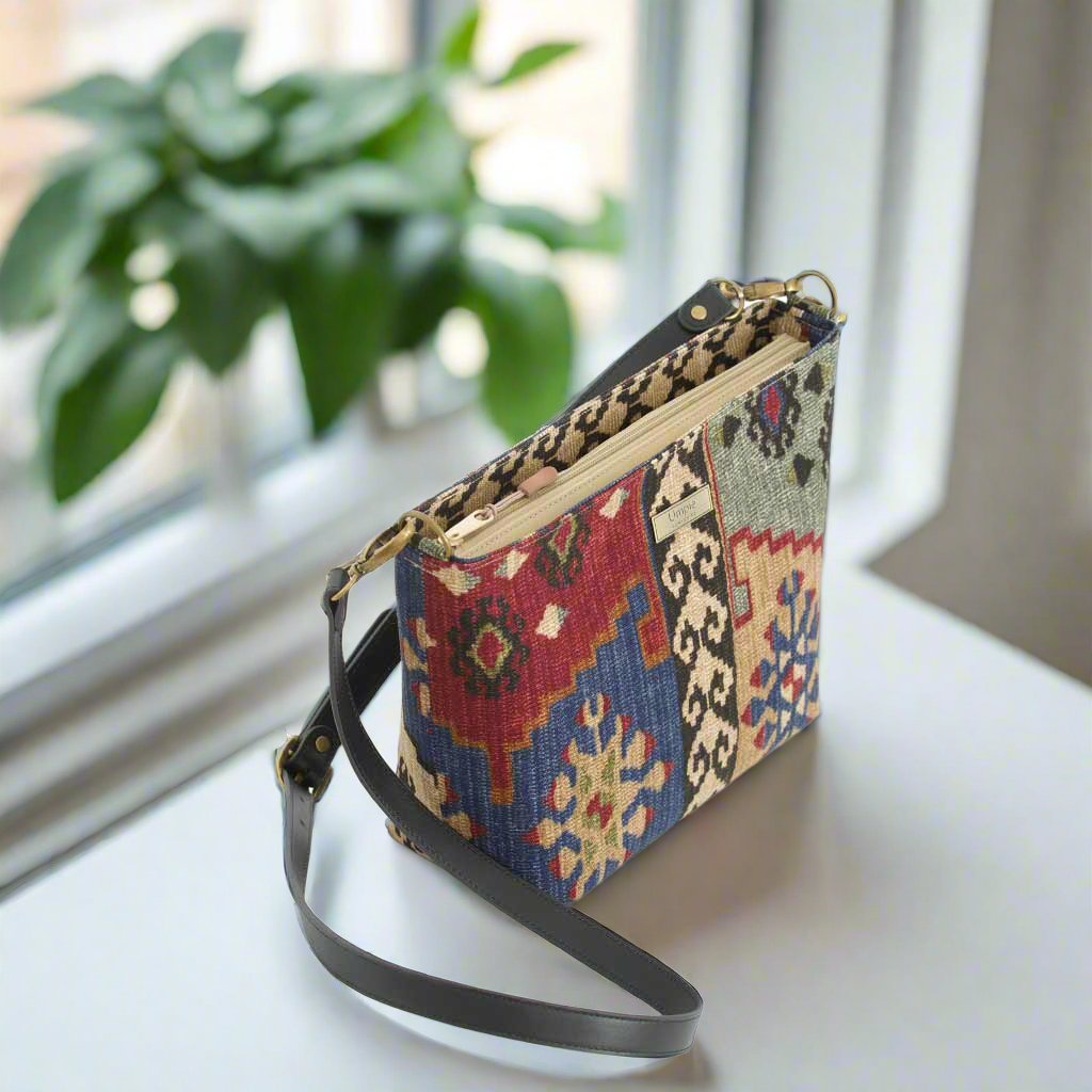 Canvas crossbody bag Kilim design showing secure zip-top closure with pull tab, revealing spacious interior compartment, structured rectangular shape - top view by Umpie Handbags