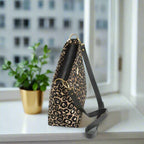 Leopard print crossbody bag with black leather strap by Umpie Handbags, zip-top view