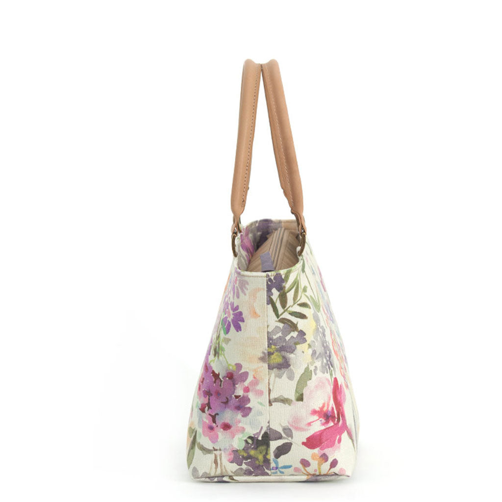 Side view of Lilac Floral Handbag with tan leather handles by Umpie Bags