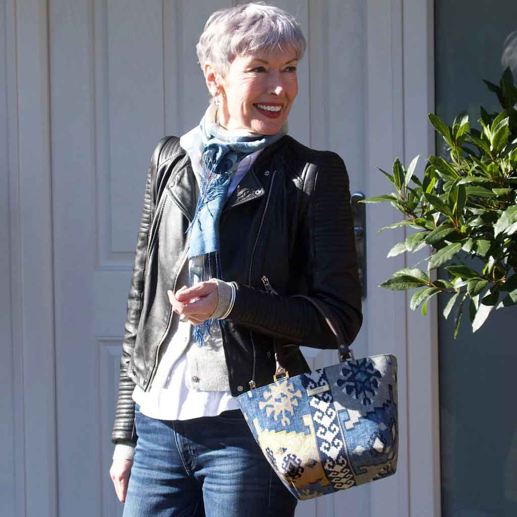 Woman holding the Navy Canvas Handbag with brown leather handles by Umpie Handbags