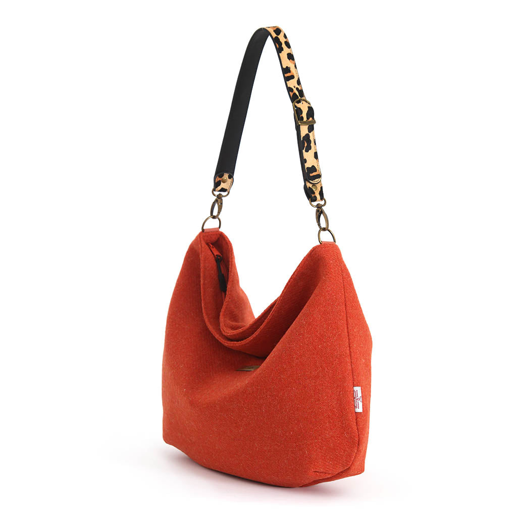 Orange Harris Tweed Hobo Bag with a leopard print leather strap by Umpie Handbags