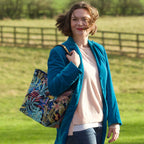 Woman holding the Floral Tote Bag with Leopard print leather straps by Umpie Handbags