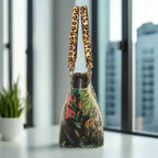 Side profile of Velvet Tiger Shoulder Bag displaying elegant silhouette and protective metal feet by Umpie Handbags




